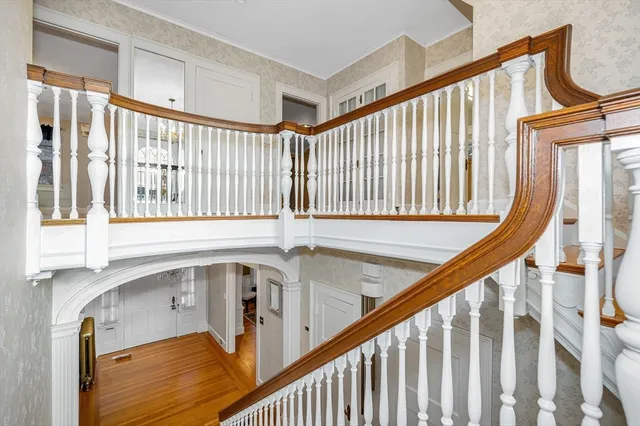 a view of entryway with wooden floor and door