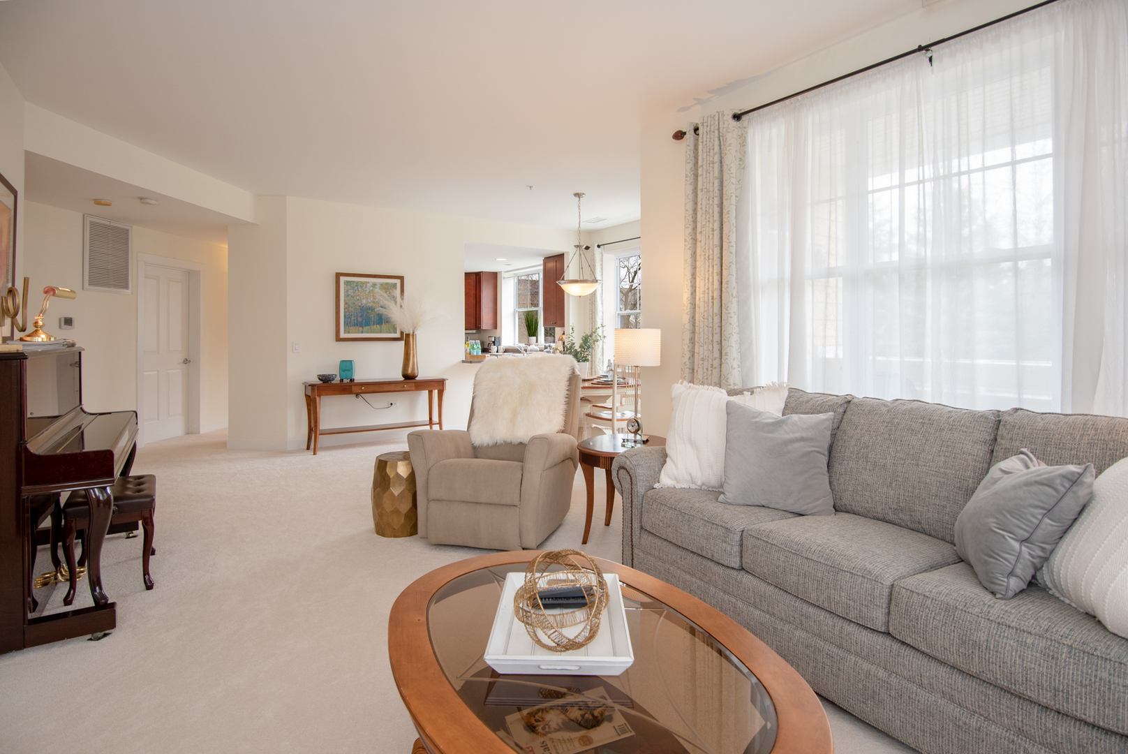 977 Harris Road, Unit 14 Grayslake, IL 60030 - Photo 11 of 21 a living room with furniture and a large window