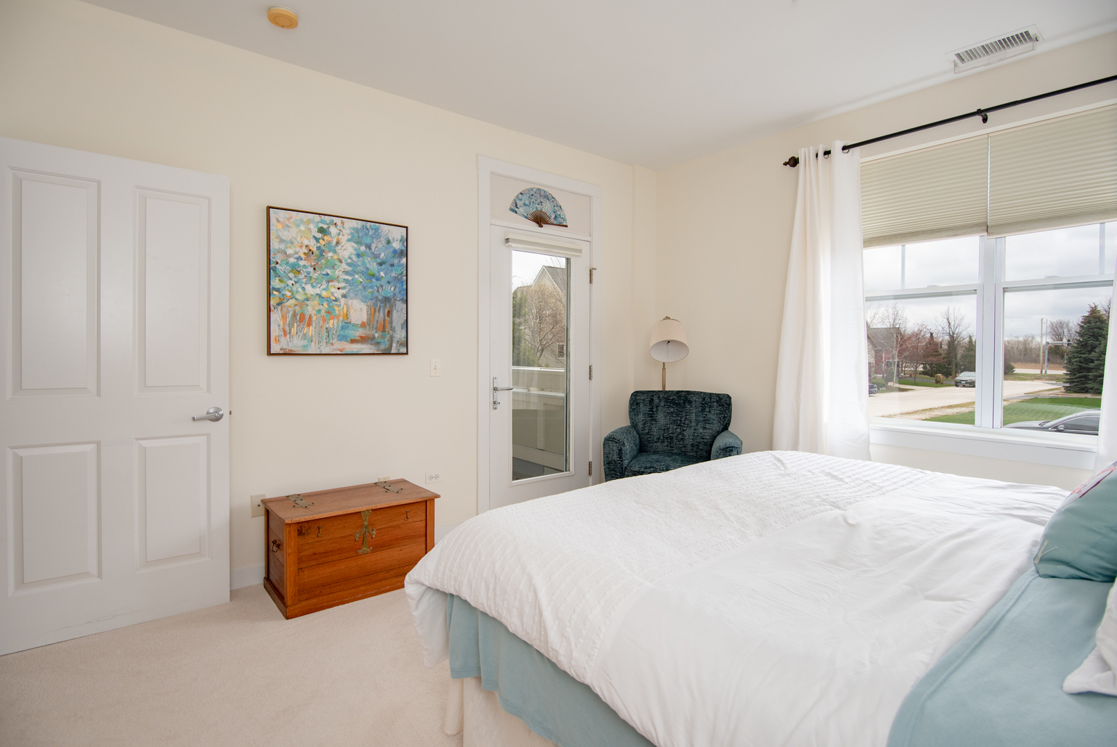 977 Harris Road, Unit 14 Grayslake, IL 60030 - Photo 14 of 21 a spacious bedroom with a bed and a large window