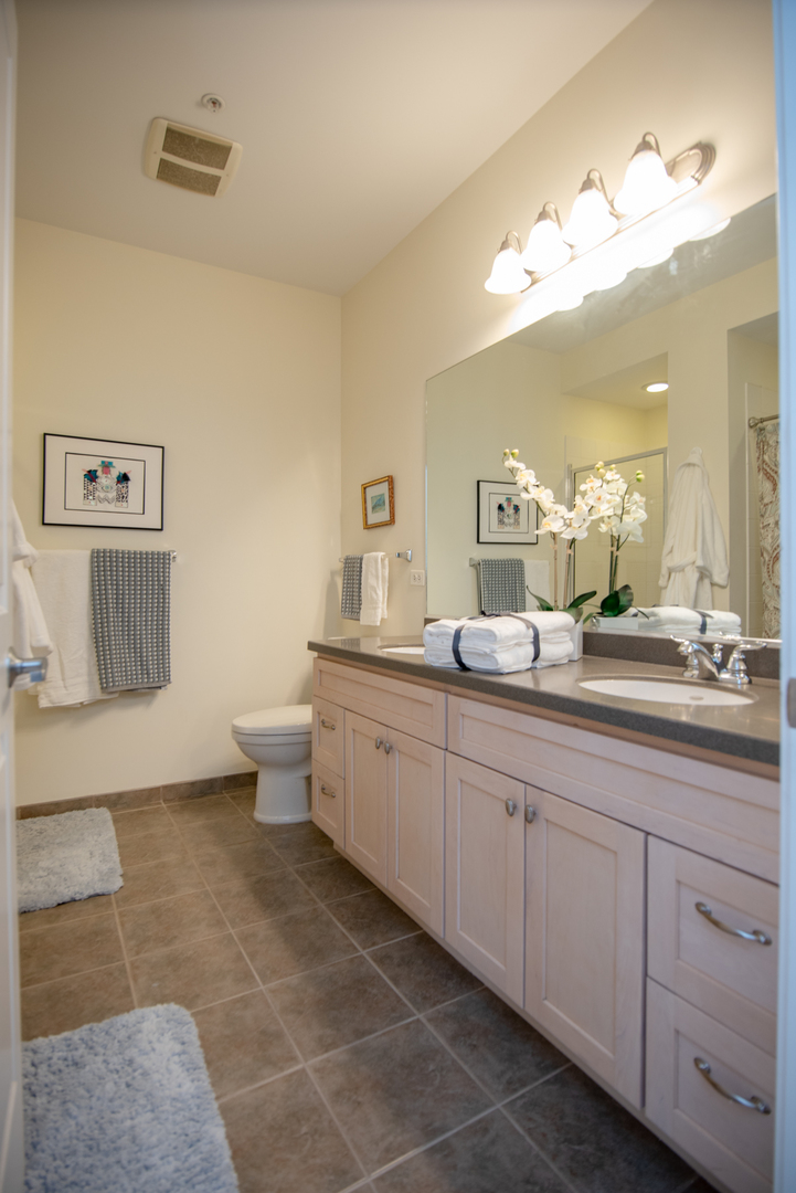 977 Harris Road, Unit 14 Grayslake, IL 60030 - Photo 15 of 21 a spacious bathroom with a double vanity sink mirror and toilet