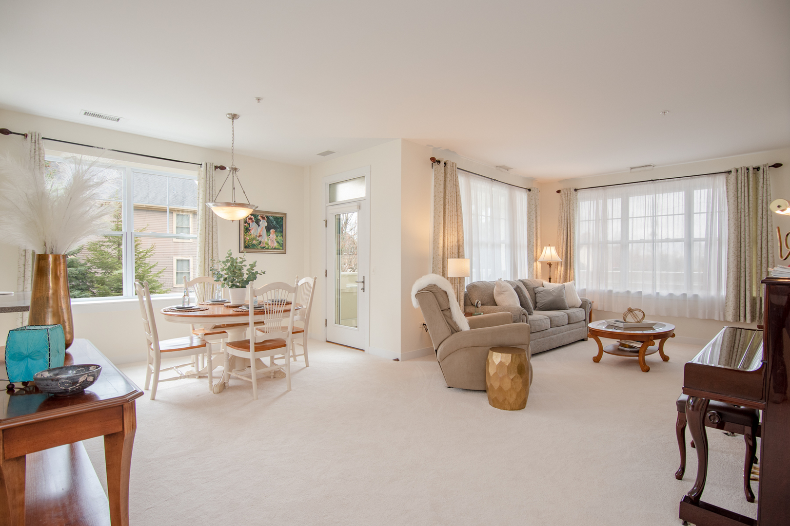 977 Harris Road, Unit 14 Grayslake, IL 60030 - Photo 6 of 21 a living room with furniture and a large window