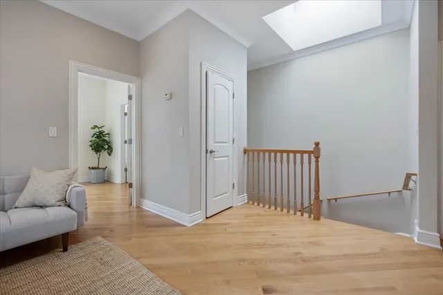 a view of a livingroom with a couch and wooden floor