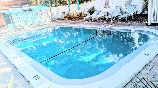 a view of a swimming pool with a yard