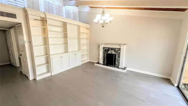 a view of an empty room with a fireplace