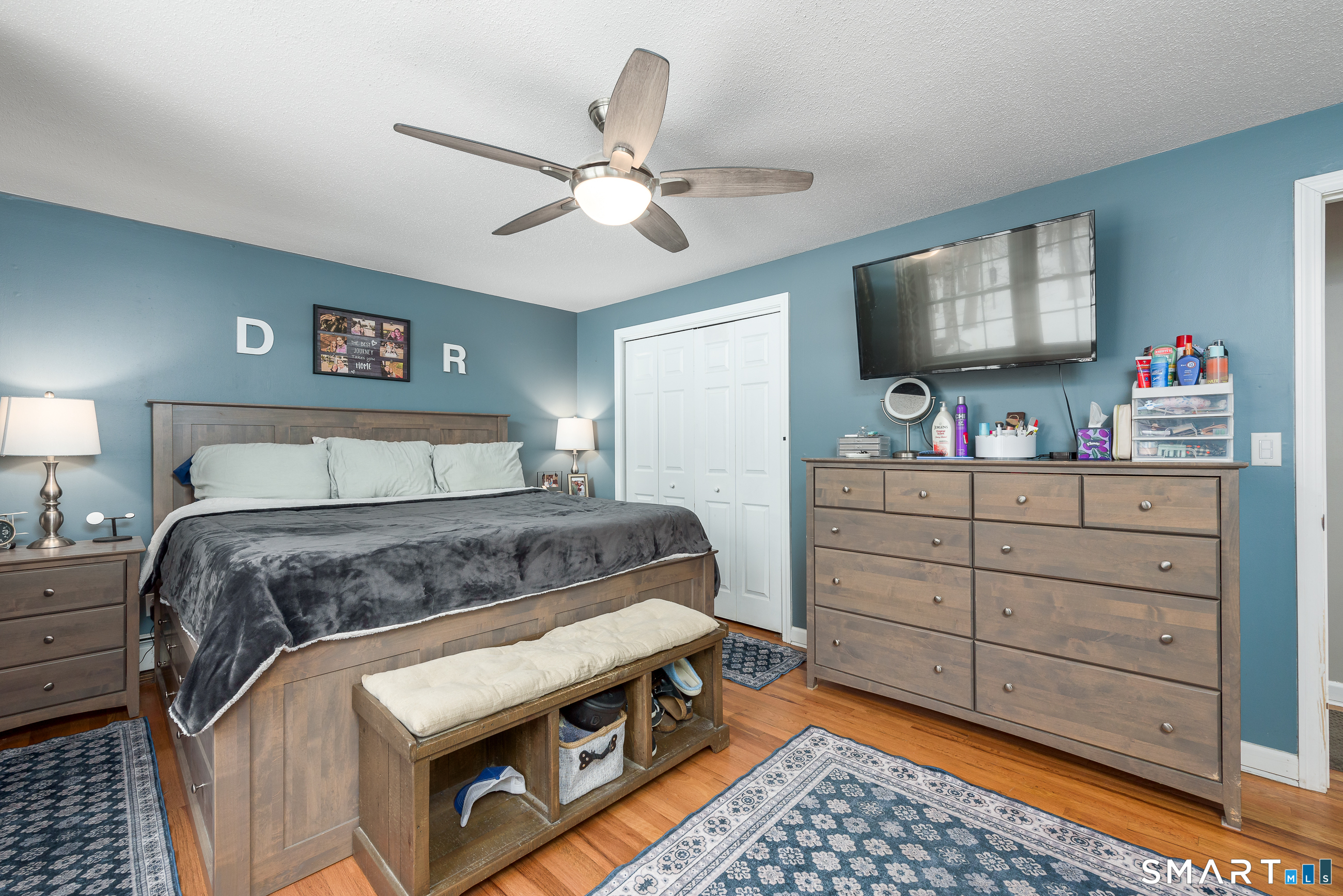 33 Northam Road Hebron, CT 06231 - Photo 14 of 36 a bedroom with a bed and a flat tv screen on dresser