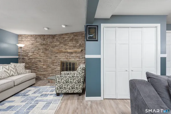 a living room with furniture and a fireplace
