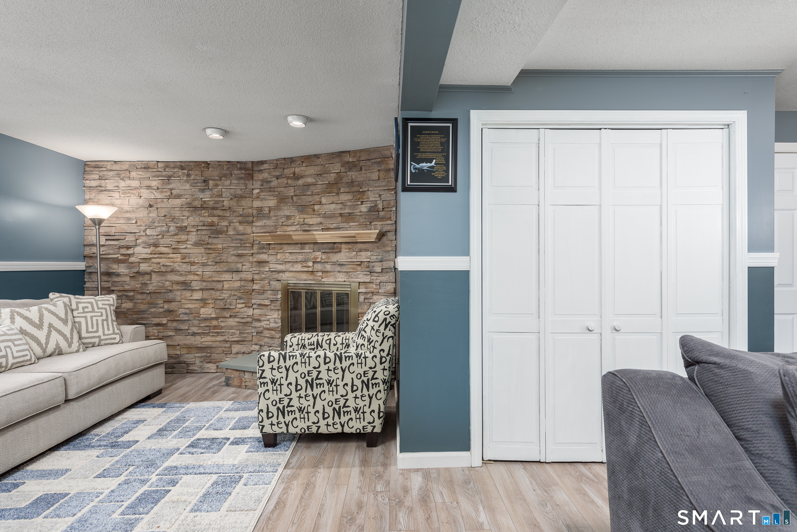 33 Northam Road Hebron, CT 06231 - Photo 25 of 36 a living room with furniture and a fireplace