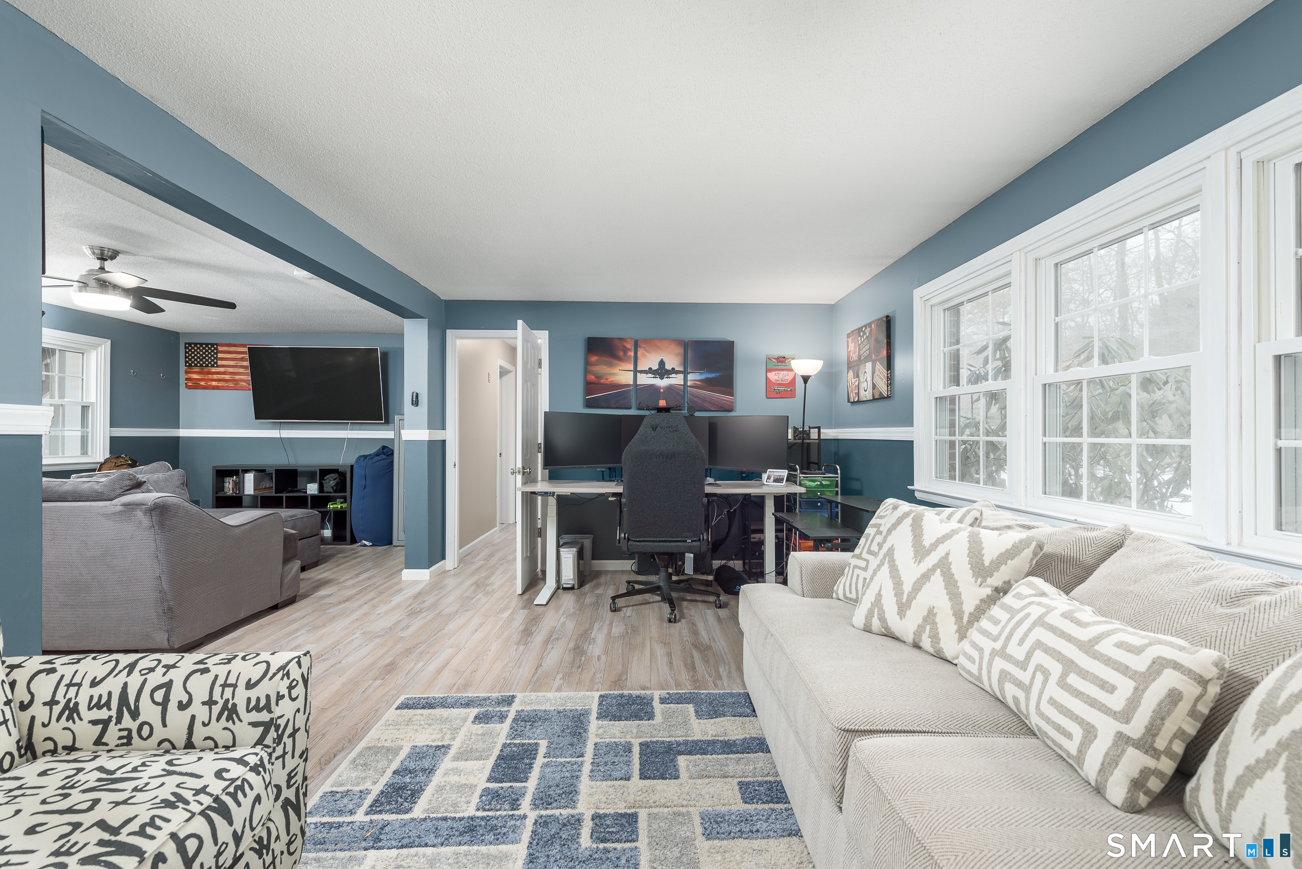 33 Northam Road Hebron, CT 06231 - Photo 27 of 36 a living room with furniture and a flat screen tv