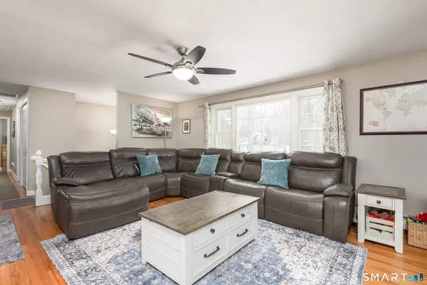a living room with furniture and a rug