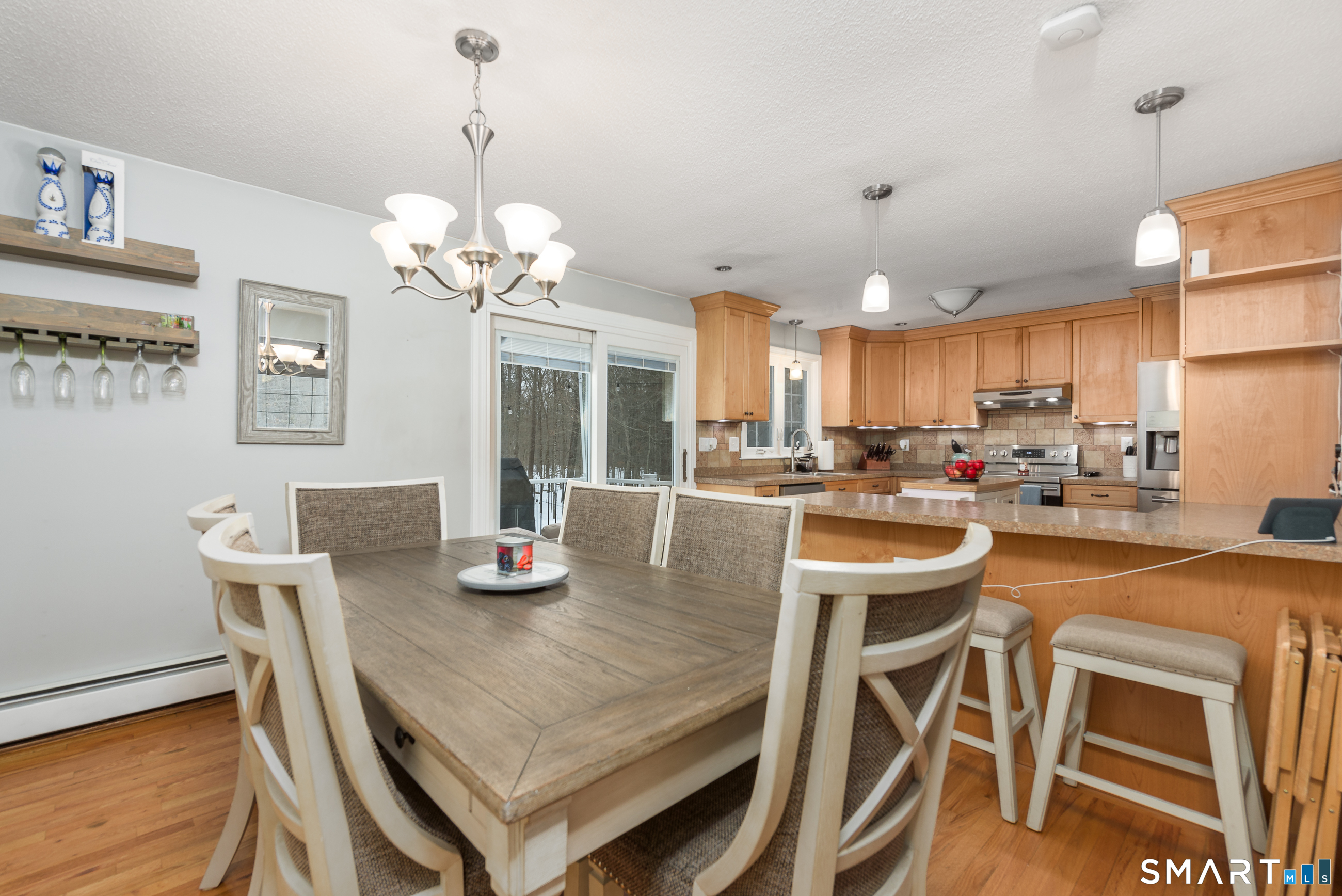33 Northam Road Hebron, CT 06231 - Photo 5 of 36 a view of a dining room with furniture a chandelier and wooden floor