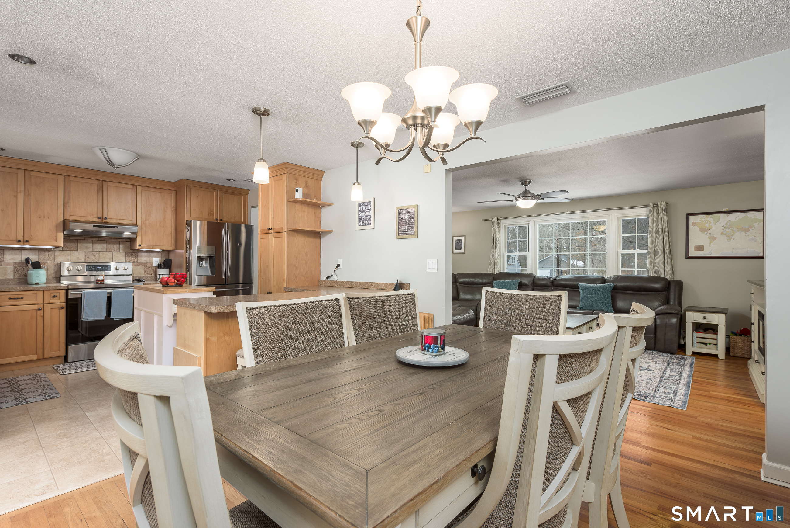 33 Northam Road Hebron, CT 06231 - Photo 6 of 36 a view of a dining room with furniture a chandelier and wooden floor