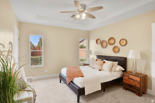 1570 South Rio Virgin Drive Washington, UT 84780 - Photo 26 of 71 Carpeted bedroom featuring a tray ceiling and a ceiling fan