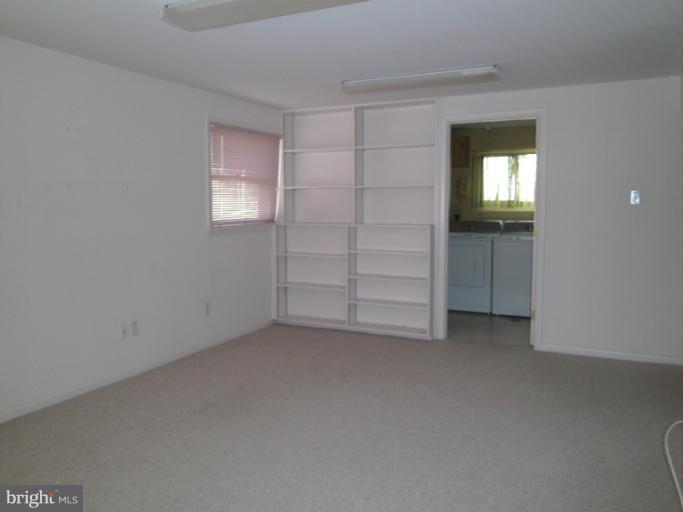 7620 Webbwood Court Springfield, VA 22151 - Photo 2 of 18 an empty room with closet and windows