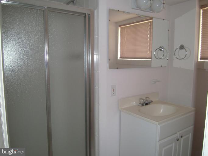 7620 Webbwood Court Springfield, VA 22151 - Photo 15 of 18 a bathroom with a sink and a mirror