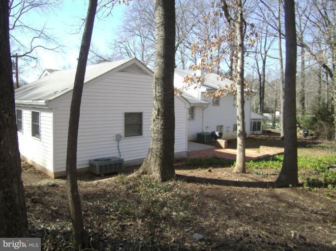7620 Webbwood Court Springfield, VA 22151 - Photo 6 of 18 a view of a house with backyard and trees