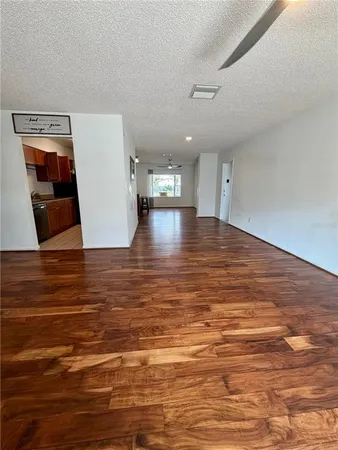 a view of a livingroom with wooden floor