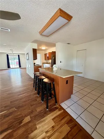 a room with wooden floor and furniture