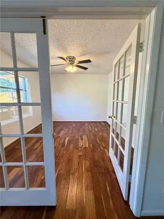 a view of an entryway with wooden floor