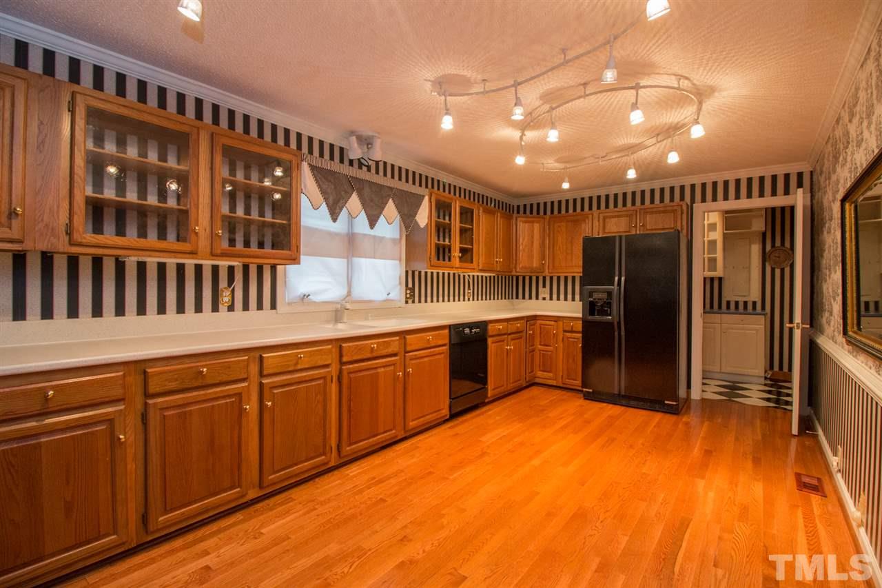 136 Bayleaf Drive Raleigh, NC 27615 - Photo 3 of 23 Good size kitchen with hardwood floors