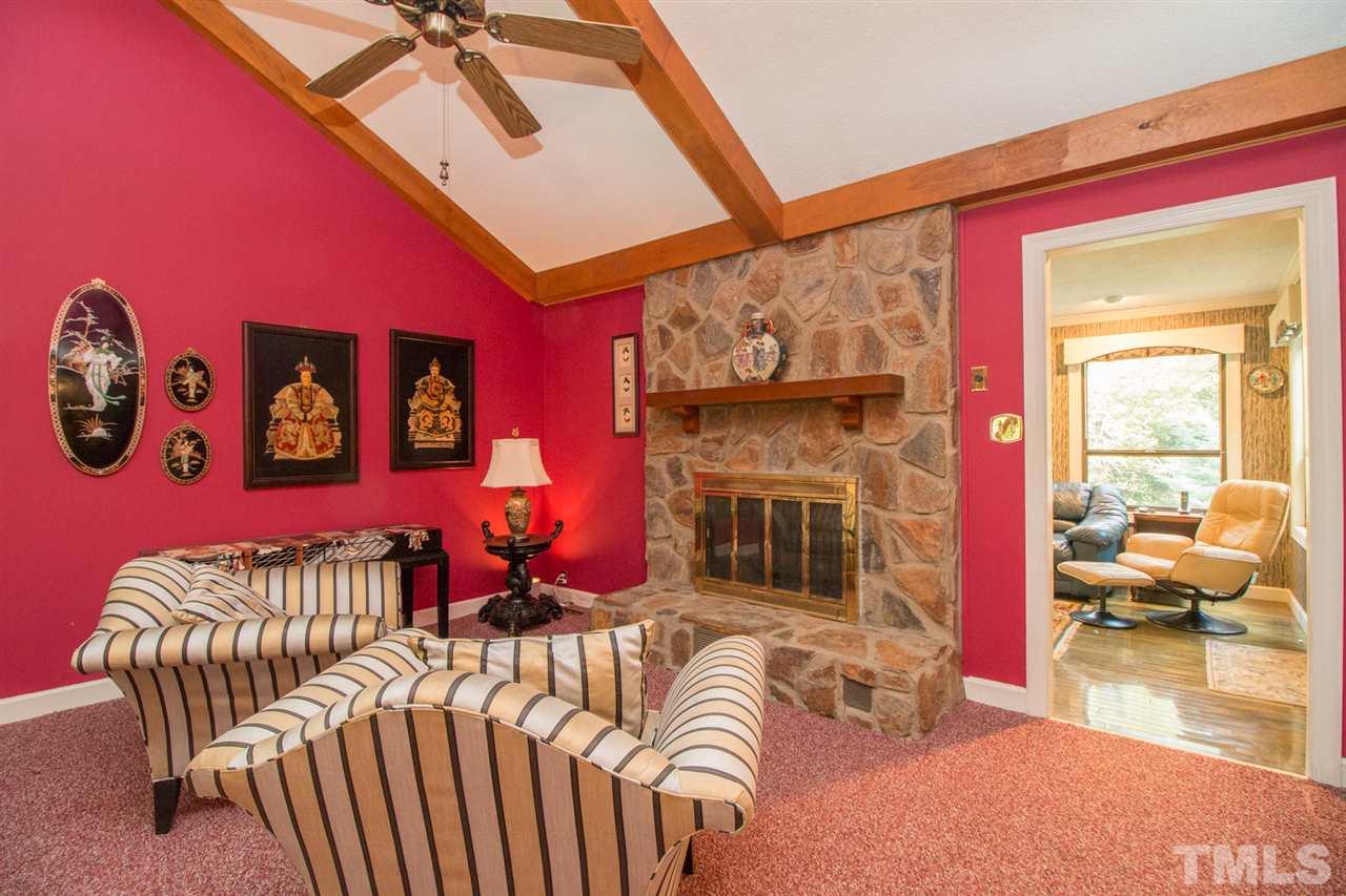 136 Bayleaf Drive Raleigh, NC 27615 - Photo 5 of 23 Stone fireplace and vaulted ceilings