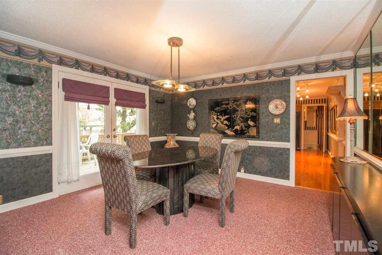 136 Bayleaf Drive Raleigh, NC 27615 - Photo 8 of 23 Good size dining room with an entrance onto the deck. French Doors!