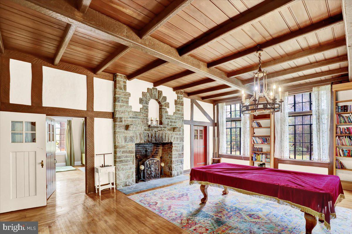 22 Ridge Road Ringtown, PA 17967 - Photo 12 of 46 a spacious bedroom with a bed and a fireplace