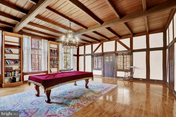 a bedroom with furniture and large window