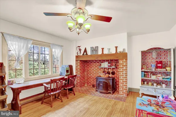 a dining room with furniture lamps and a chandelier