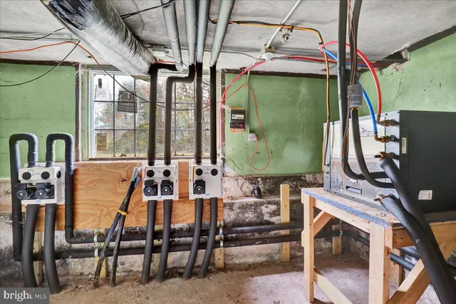 a front view of a house with outdoor seating