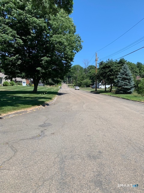 148 Kennedy Drive Orange, CT 06477 - Photo 12 of 13 a view of a field of grass and trees