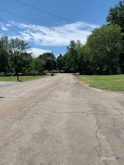 148 Kennedy Drive Orange, CT 06477 - Photo 13 of 13 a view of an outdoor space and a yard