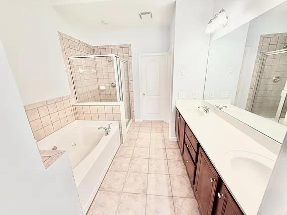 2070 Callaway Court Atlanta, GA 30318 - Photo 17 of 30 a spacious bathroom with a tub sink and mirror
