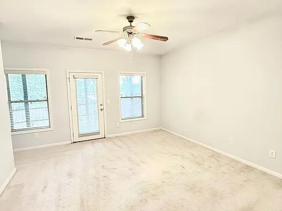 2070 Callaway Court Atlanta, GA 30318 - Photo 23 of 30 an empty room with windows and fan