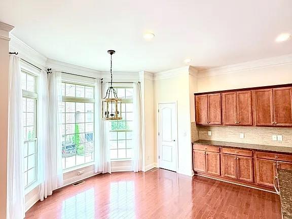 2070 Callaway Court Atlanta, GA 30318 - Photo 4 of 30 a kitchen with stainless steel appliances granite countertop a stove a sink and a refrigerator with wooden floor