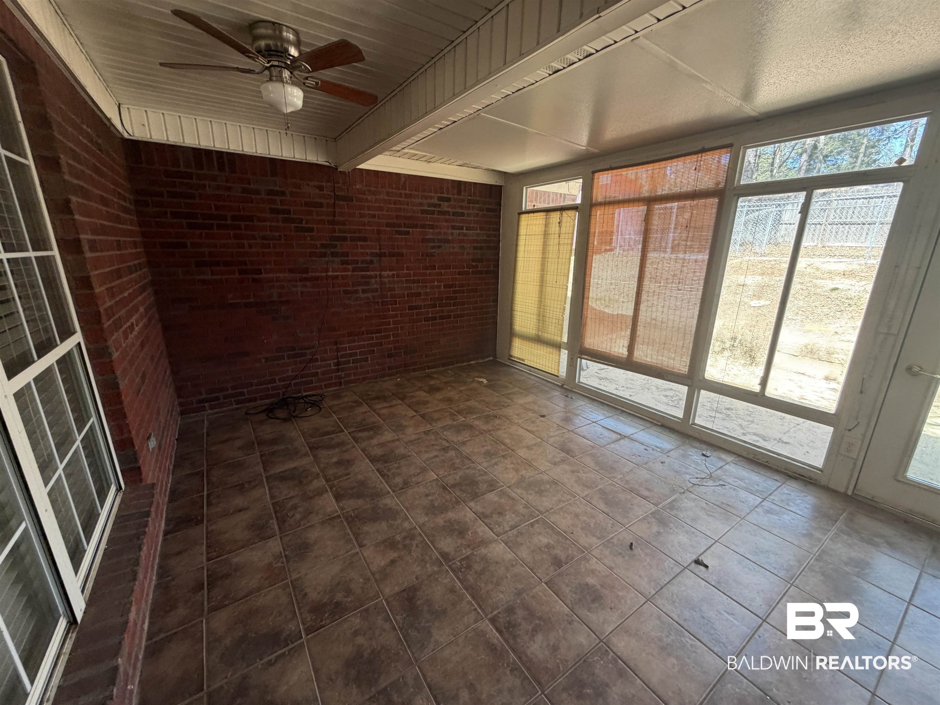 7067 Pinehill Road Daphne, AL 36526 - Photo 18 of 18 Unfurnished sunroom featuring ceiling fan
