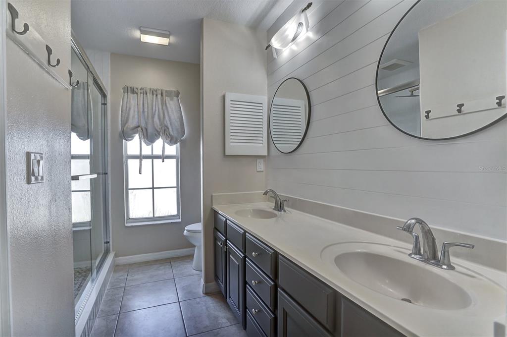 5010 Treasure Cay Road Tavares, FL 32778 - Photo 12 of 32 a bathroom with a sink and a mirror