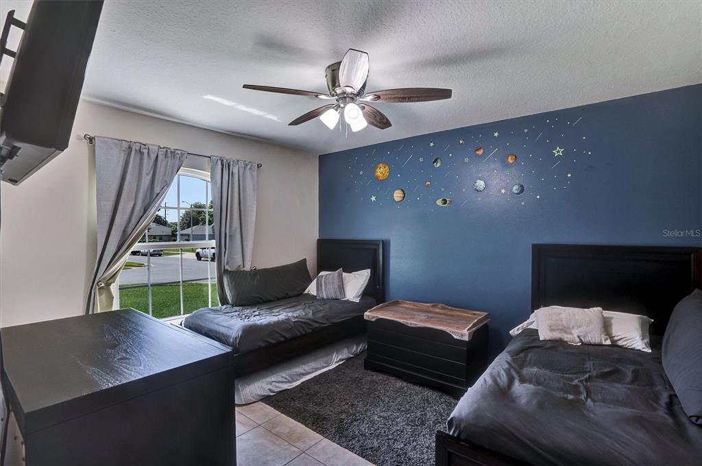 5010 Treasure Cay Road Tavares, FL 32778 - Photo 17 of 32 a living room with furniture and a chandelier
