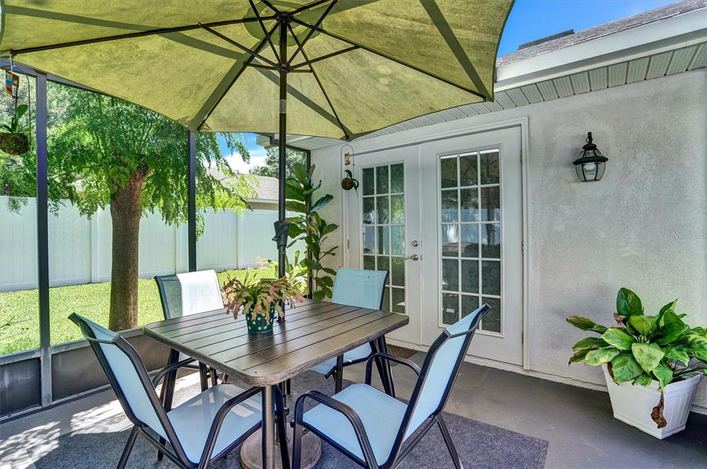 5010 Treasure Cay Road Tavares, FL 32778 - Photo 21 of 32 a view of an outdoor dining space with a table and chairs