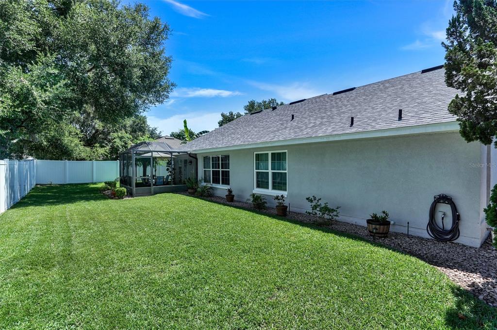 5010 Treasure Cay Road Tavares, FL 32778 - Photo 23 of 32 a front view of house with yard and green space