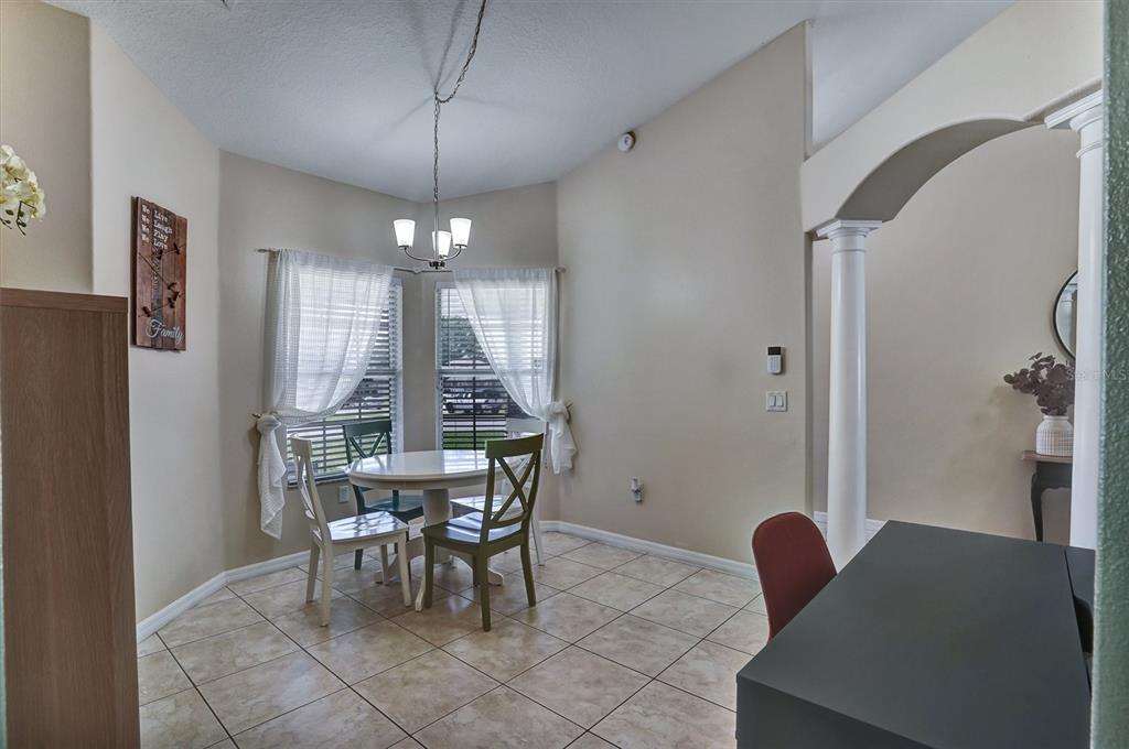 5010 Treasure Cay Road Tavares, FL 32778 - Photo 3 of 32 a view of a dining room with furniture and window