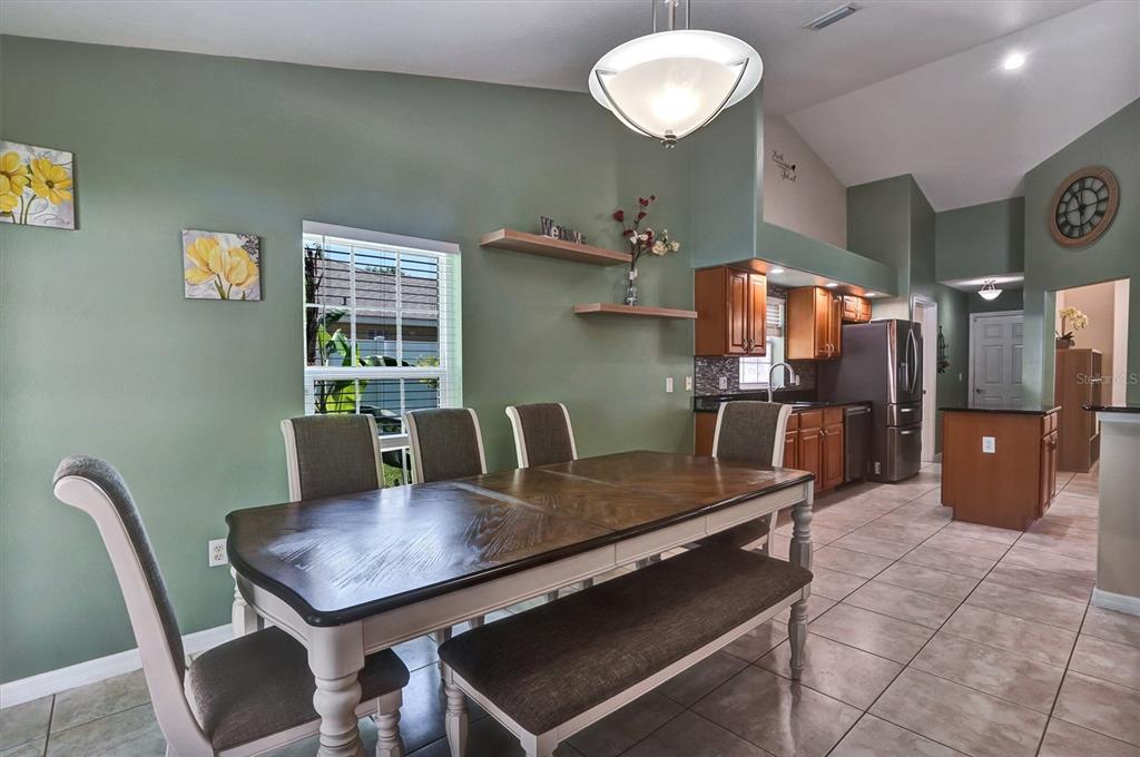 5010 Treasure Cay Road Tavares, FL 32778 - Photo 7 of 32 a dining room with furniture and window