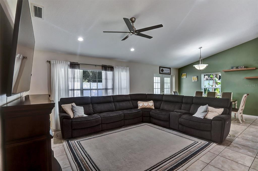 5010 Treasure Cay Road Tavares, FL 32778 - Photo 8 of 32 a living room with furniture and a flat screen tv