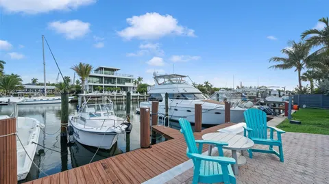 a view of a roof deck with furniture