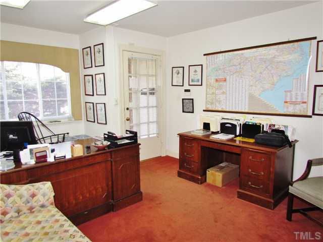 16 Horne Street Raleigh, NC 27607 - Photo 3 of 6 a view of a workspace with furniture and a window