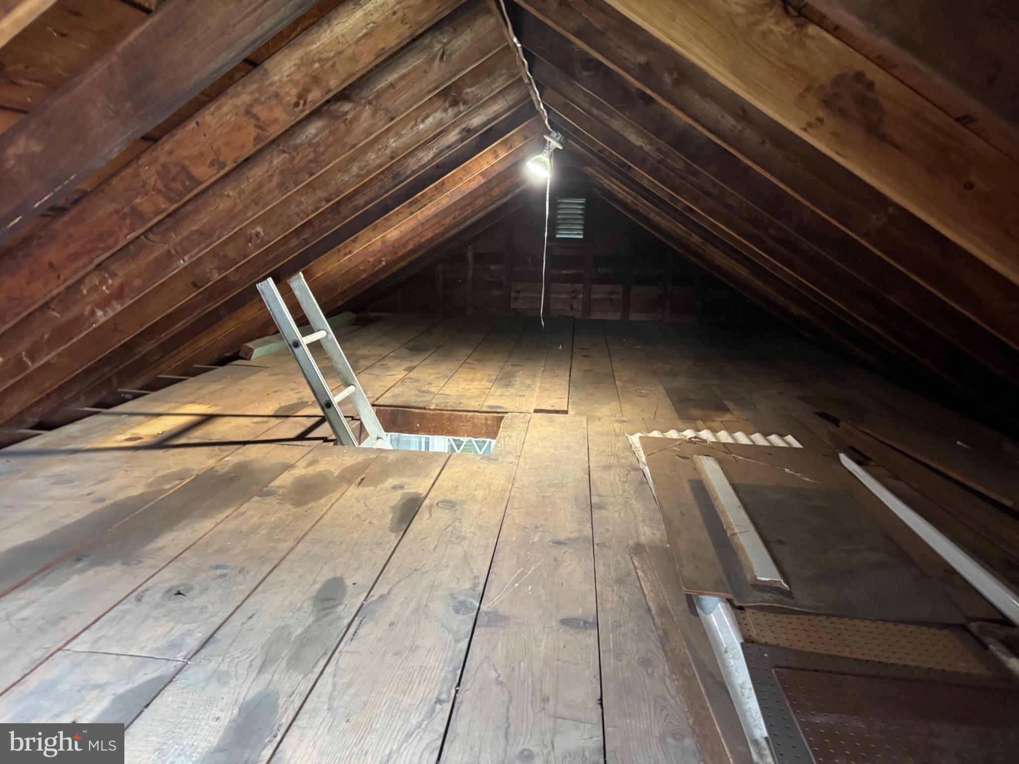 835 Martin Road Baltimore, MD 21221 - Photo 22 of 27 Spacious attic with rustic charm.