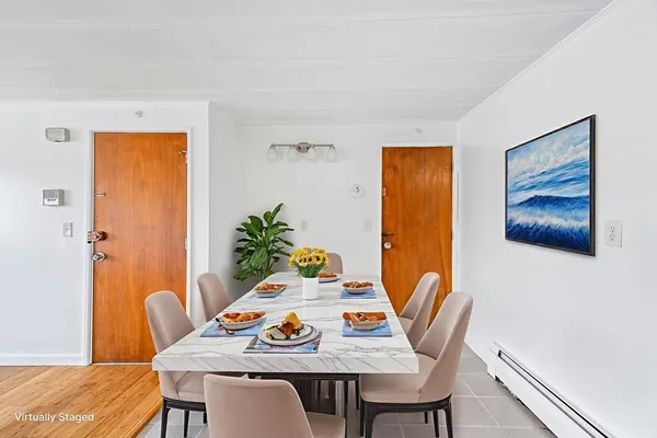 a view of a dining room with furniture and wooden floor