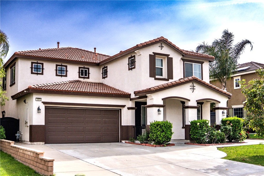 1373 Aztec Court Beaumont, CA 92223 - Photo 1 of 56 a front view of a house with a yard and garage