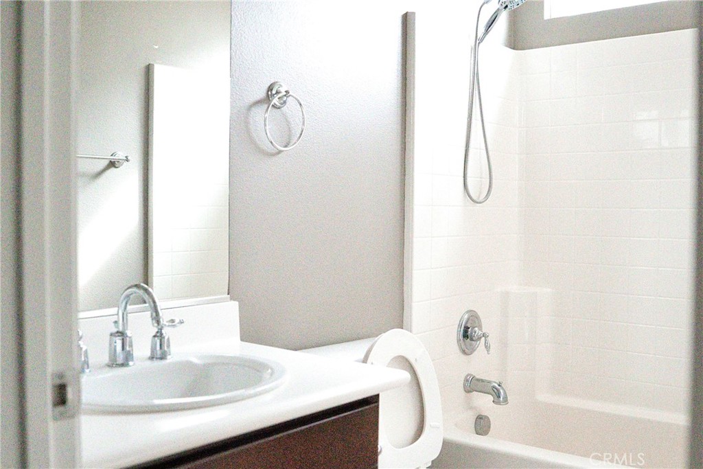 1373 Aztec Court Beaumont, CA 92223 - Photo 14 of 56 a bathroom with a sink vanity tub and shower