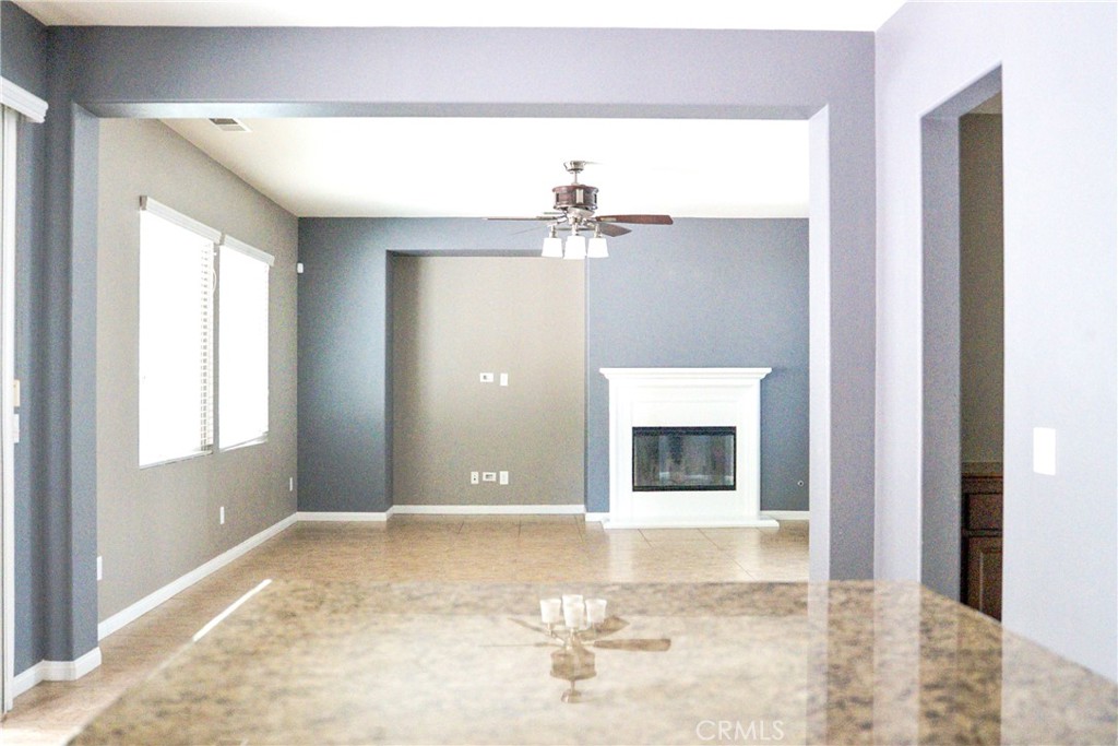 1373 Aztec Court Beaumont, CA 92223 - Photo 19 of 56 a view of a hallway to a bedroom with a window