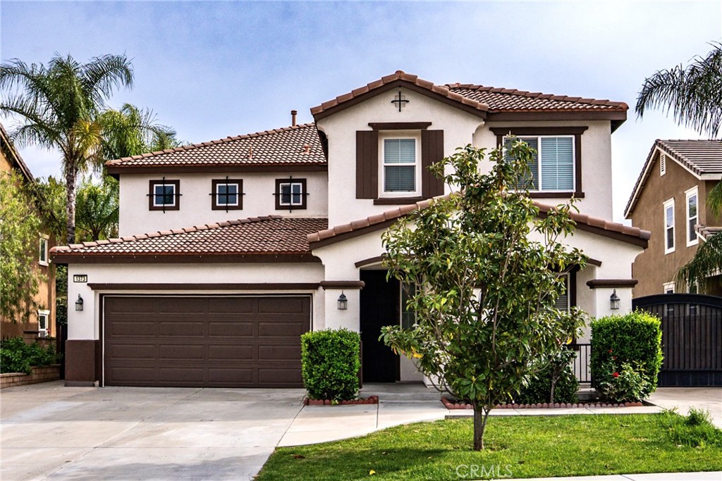1373 Aztec Court Beaumont, CA 92223 - Photo 2 of 56 a front view of a house with a yard and garage
